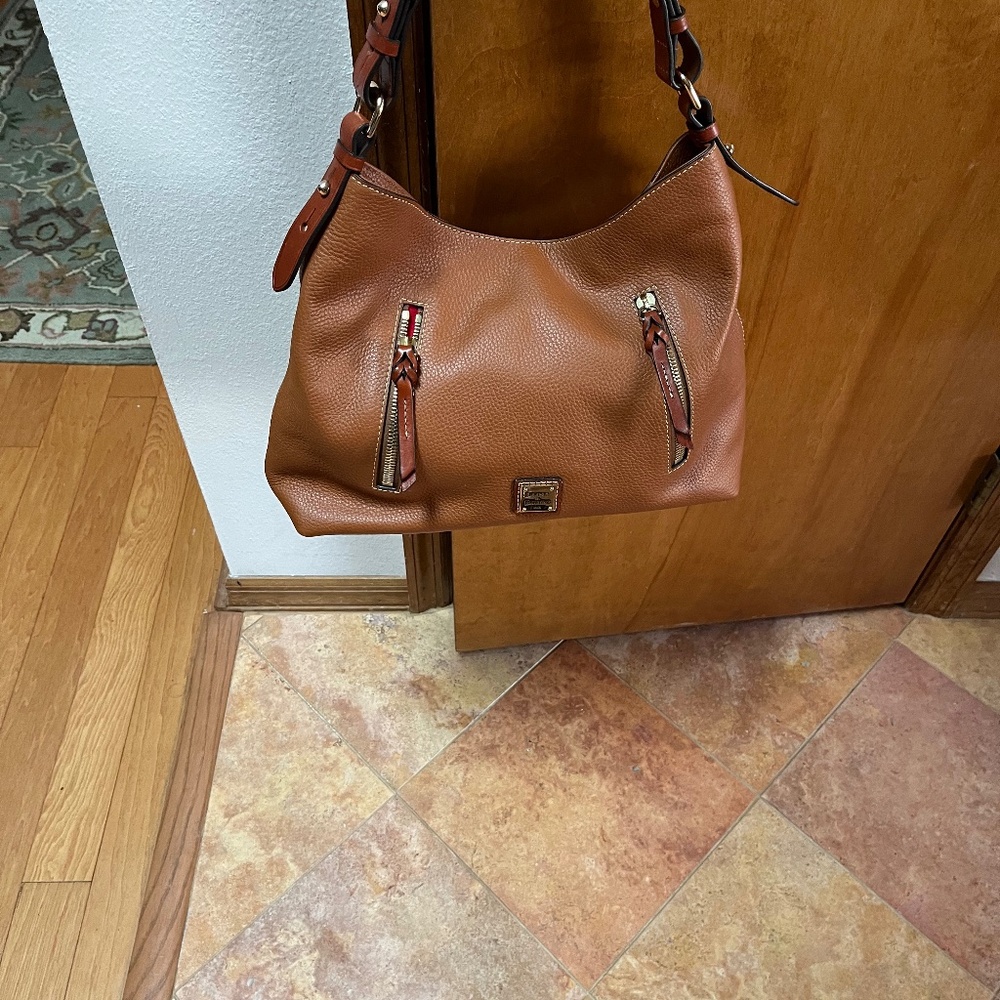 Dooney and Bourke never used